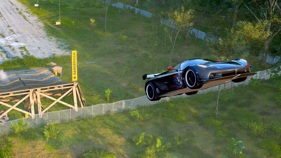 Voiture en plein saut sur un panneau danger